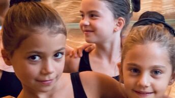 Children in a ballet studio having fun together